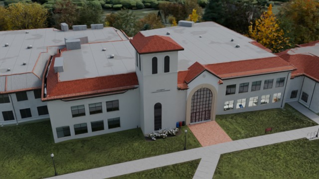 Aerial render of the College of Communication and Media building, with a white tower, red tile roofs and a grass quad.
